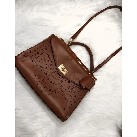 BCBGMaxAzria laser cut trapeze handbag